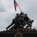 Iwo Jima Memorial depicting soldiers raising the US flag, a symbol of valor.