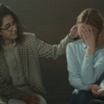 A comforting moment during a support session, highlighting empathy and understanding.